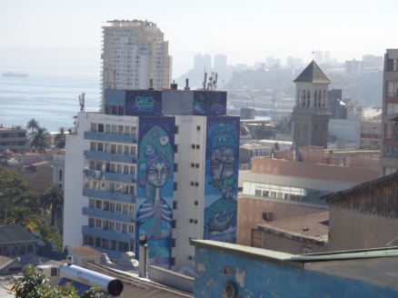 Huge murals adorn the sides of apartment blocks